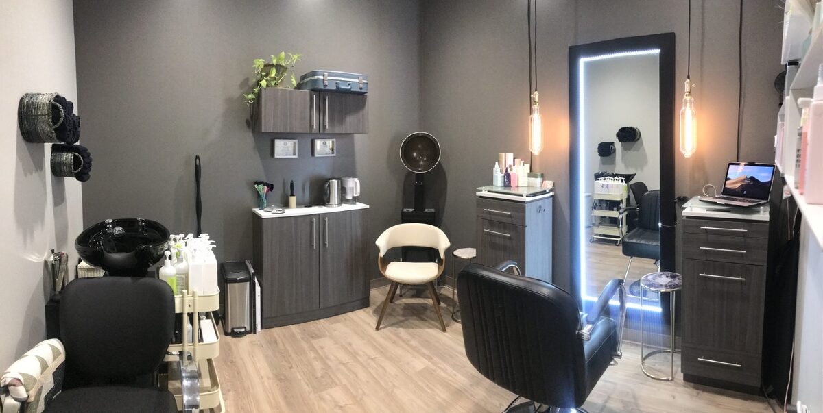 Hair salon suite with grey walls and shampoo bowl