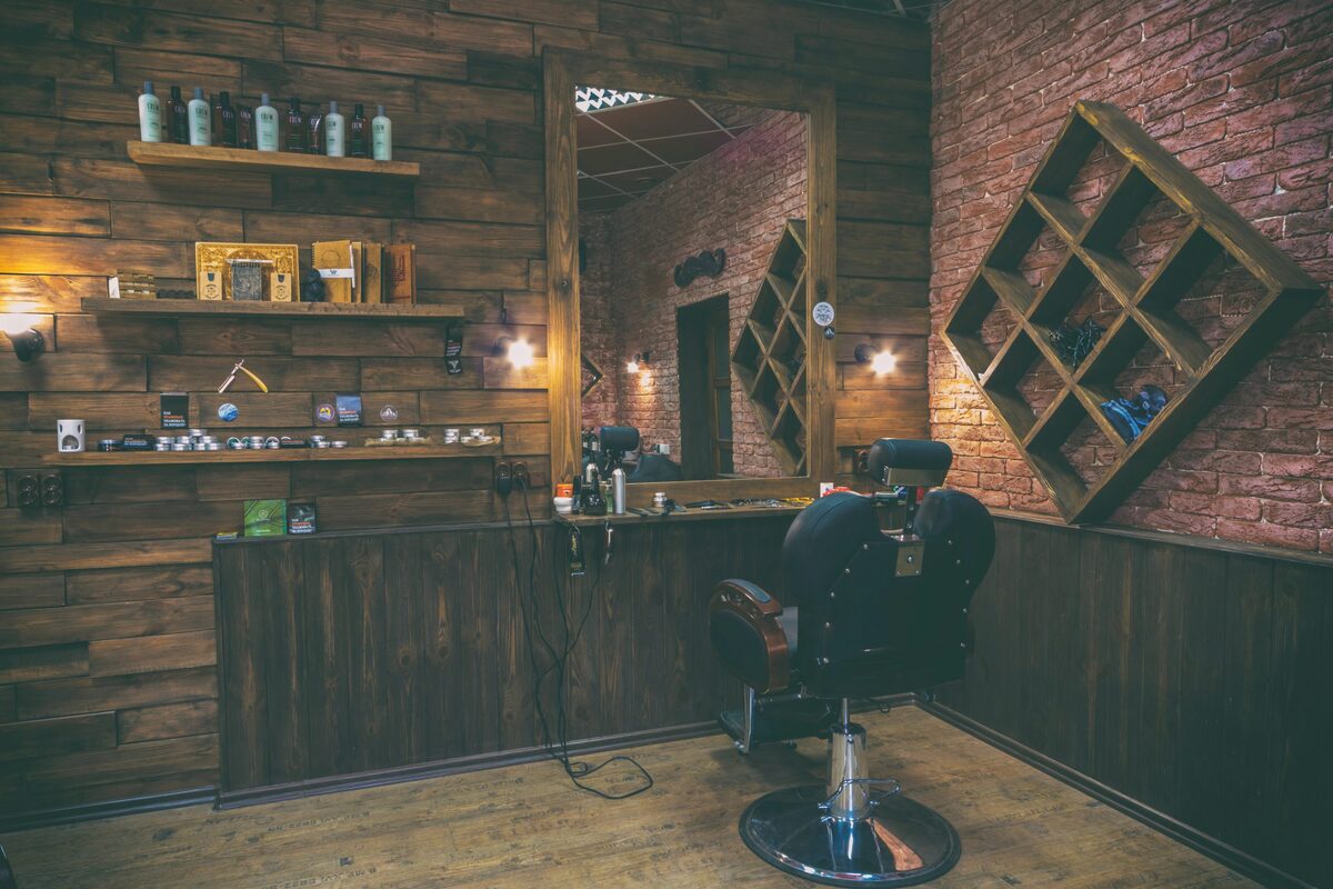Rustic barber suite with reclaimed wood walls