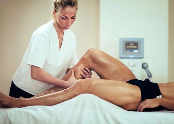 Massage therapist delivering a calm spa treatment for a client